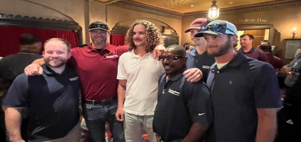 Gilbert Howard with Colonial Webb team members celebrating his electrician apprenticeship completion